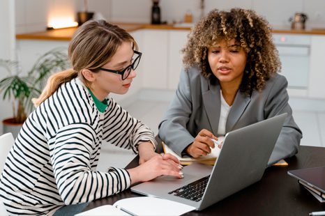 Two women are talking about workplace engagement